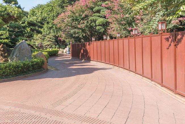 Fence panels alongside a driveway